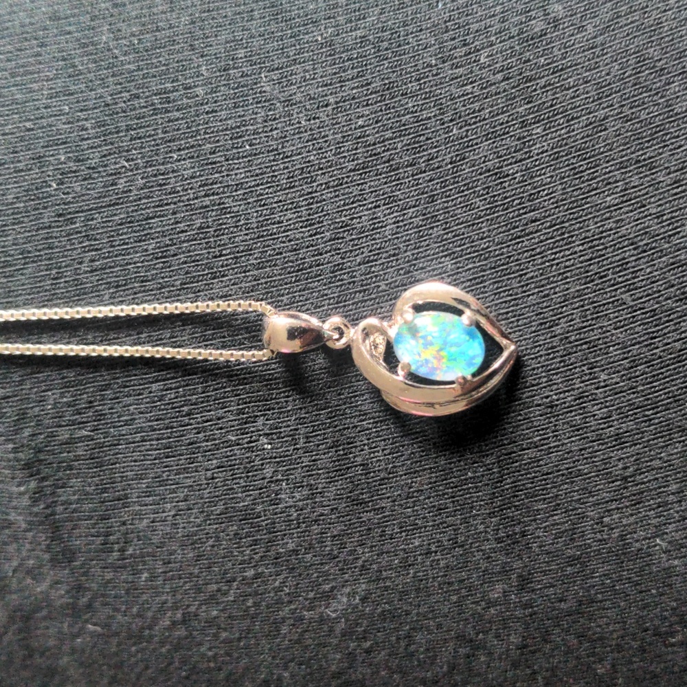 16" Sterling silver chain with opal pendant. Spring ring clasp.